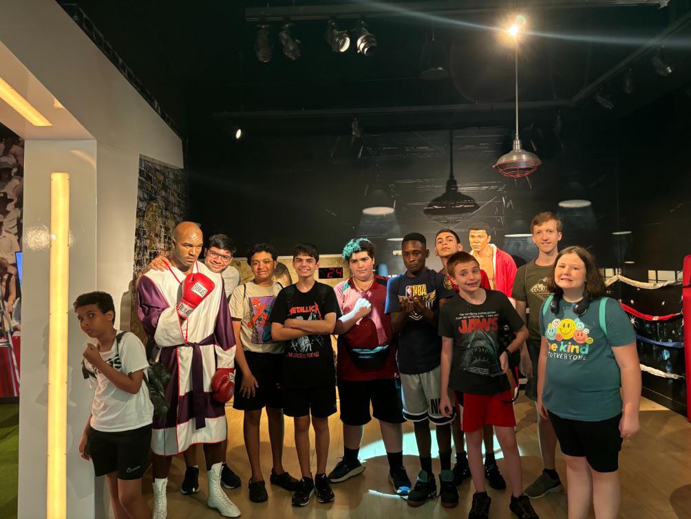 kids with Evander Holyfield statue